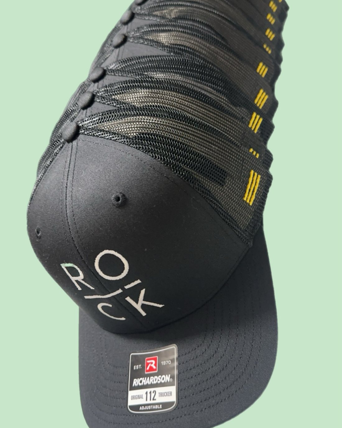 Stack of embroidered iRock Fitness caps