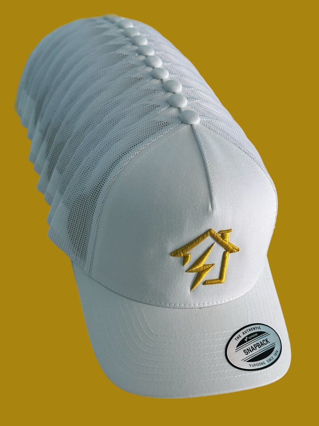 Stonehouse Electric Company logo embroidered on a stack of white caps