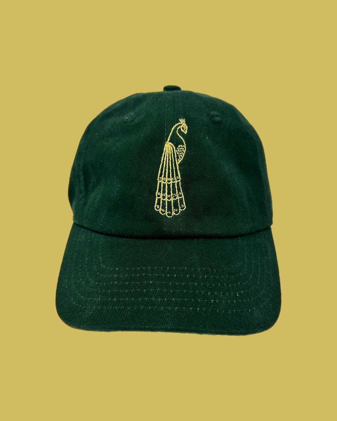 Finely digitized peacock emblem embroidered on a cap